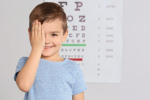 Cute little boy visiting children's doctor, space for text. Eye Exams for Children