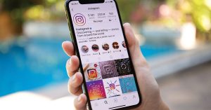 Woman hand holding iPhone X with social networking service Instagram on the screen. iPhone 10 was created and developed by the Apple inc.; instagram accounts for parents to follow