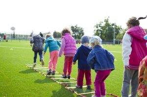 Kids together in jumping competition HealthPark Pediatrics Children's Health Month