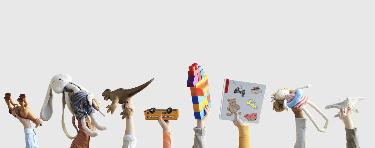 Children holding toys, concept of the childhood / blog - safe toys for children